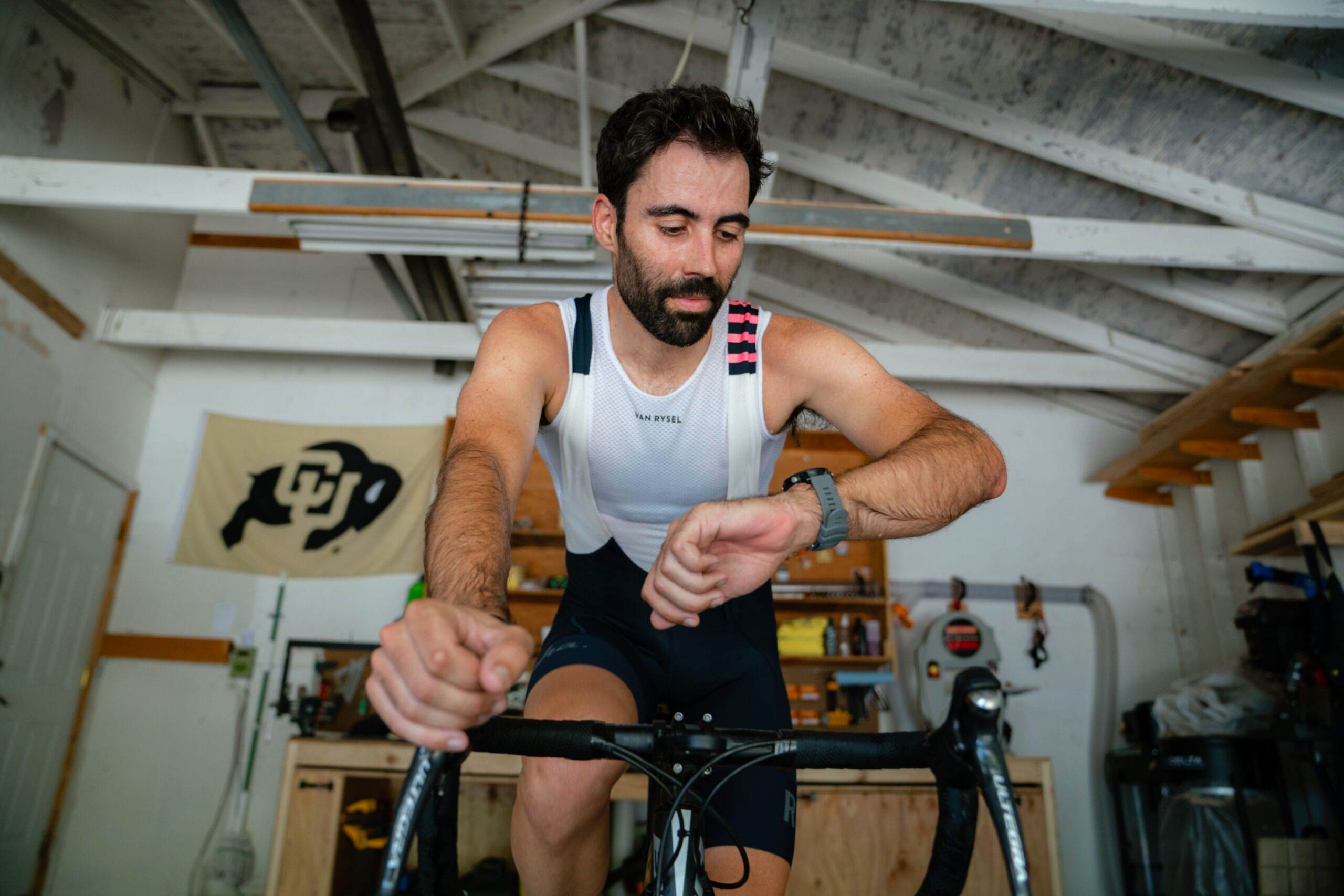 Male Cyclist On Indoor Training Doing 60 Minute Cycling Workout Indoors