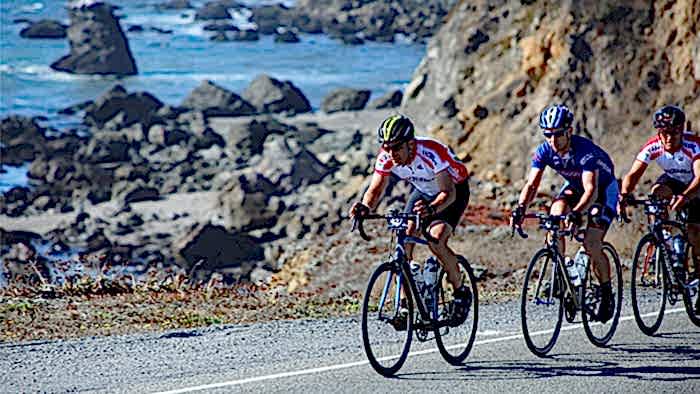 Cyclist On Coastal Bike Path With A Buddy Preparing For A Century Ride