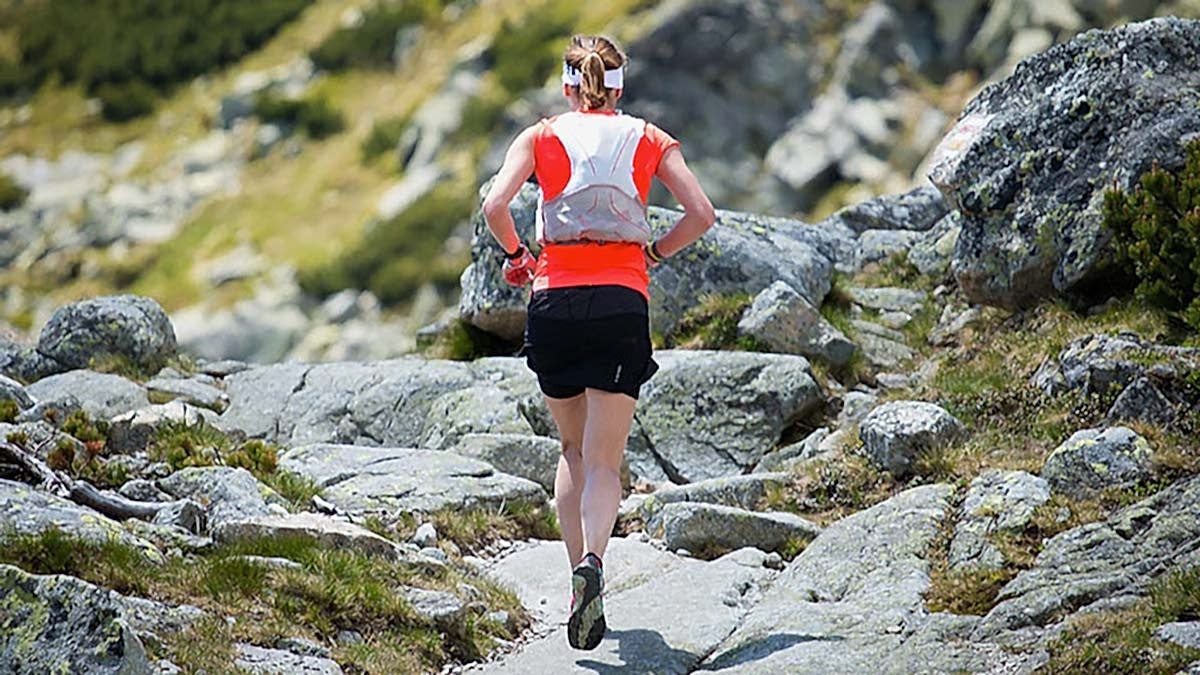 05139 How To Make The Jump From Marathons To Ultras A Female Trail Runner On A Rocky Trail Above Tree Line