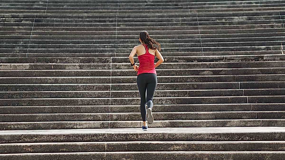 Fitness Woman She Is Running Up The Stairs. Fine Line Between Functional Training And Overreaching