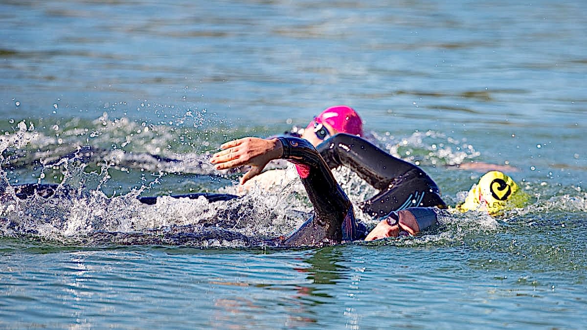 Open Water Swimmers Swimming In An Ironman Race After Preparing With An Ironman Training Plan