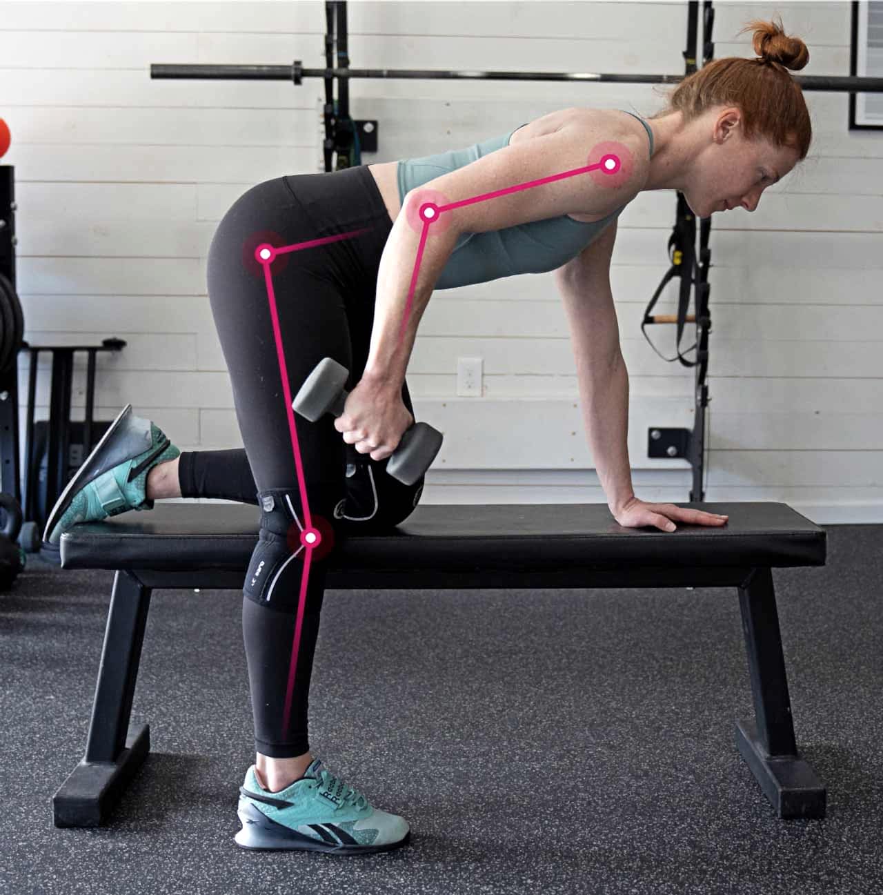 Female Athlete Performing Unilateral Movement I.e. Tricep Extension