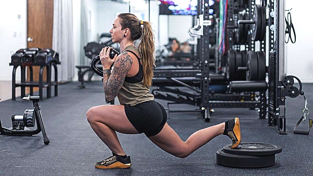 Female Strength Training Athlete Performing Bulgarian Split Squat Female Strength Training Athlete Performing Bulgarian Split Squat