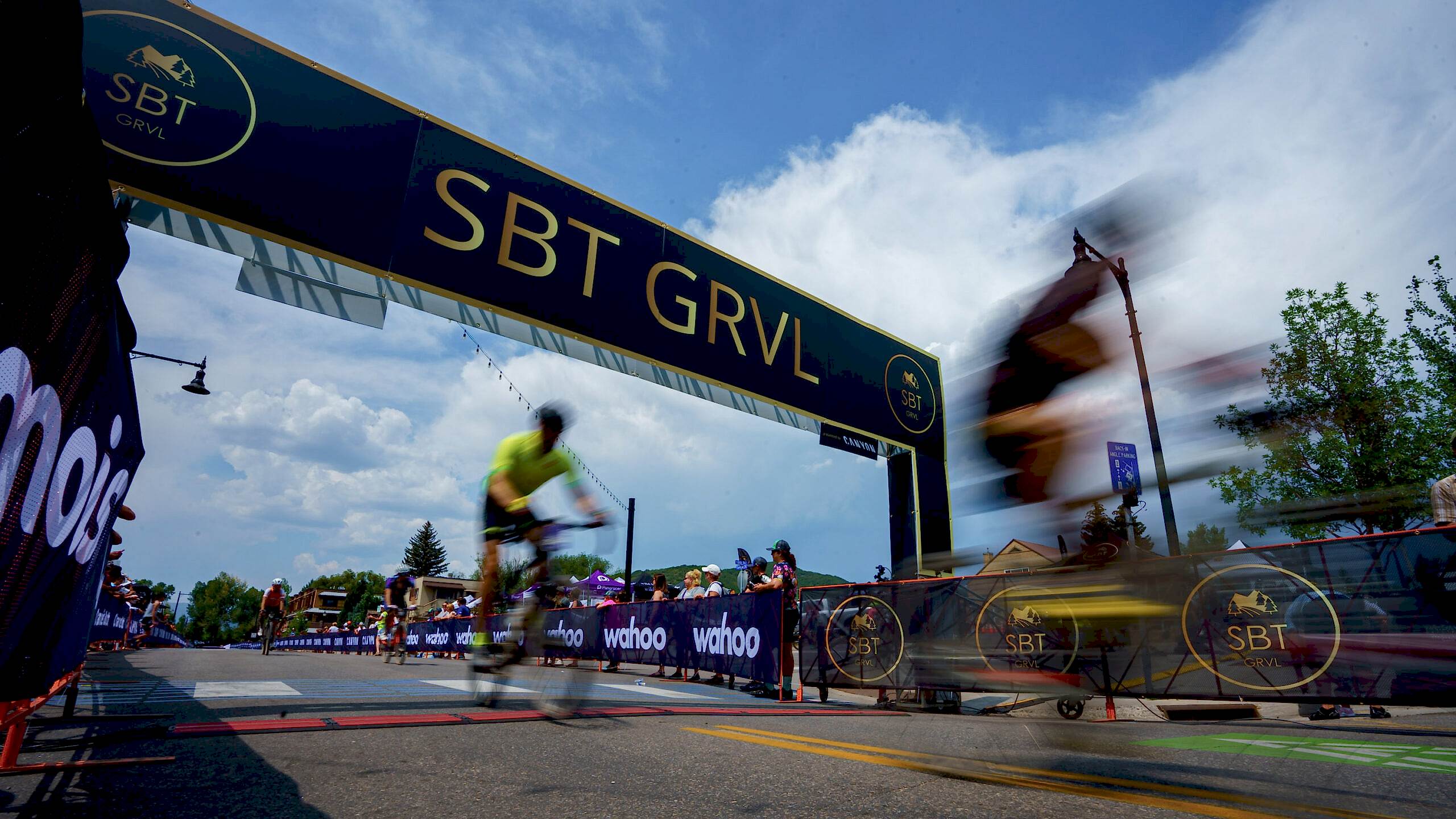 Photo At The Finish Line Of The Sbt Grvl Race In Colorado As Two Riders Cross The Timing Mat