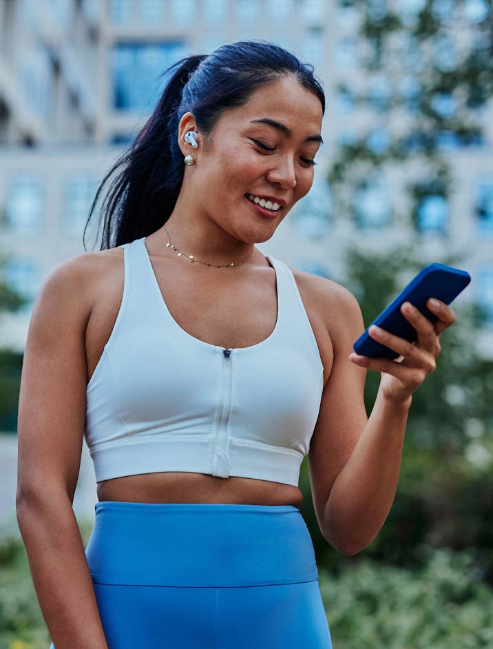 Athletic Woman Looking At Phone 716×942 Athletic Woman Looking At Phone 716x942