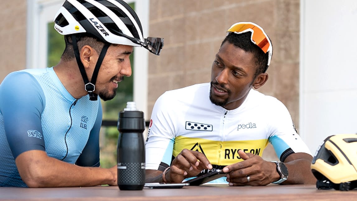 One On One Coaching Tailored To You. Coach Showing Male Cyclist How To Train With Trainingpeaks.