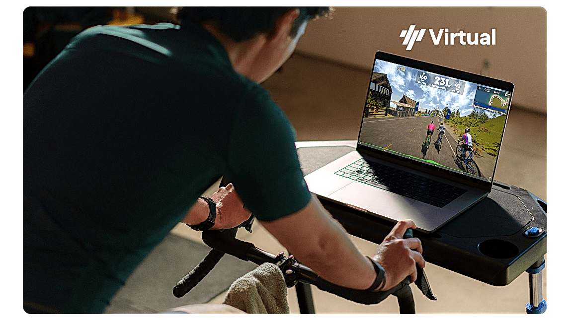 Virtual Male Cyclist On Trainer With Trainingpeaks Virtual On Laptop