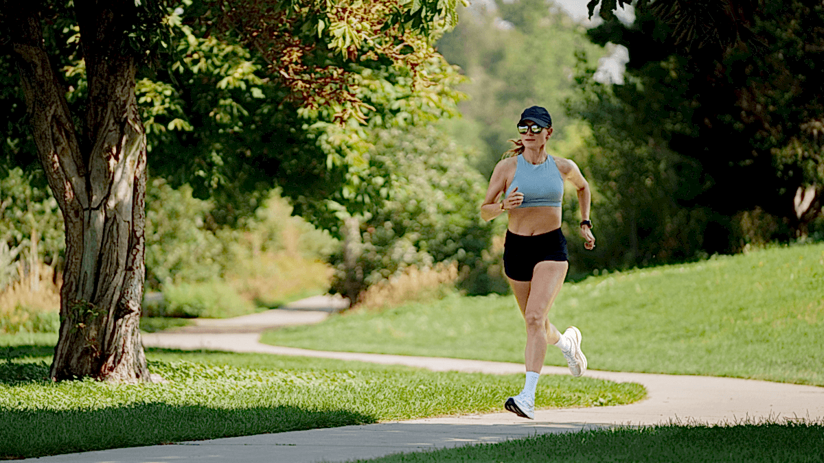 Seeing Is Believing: Visualize Your Workout Data Female Athlete Running On Dirt Road